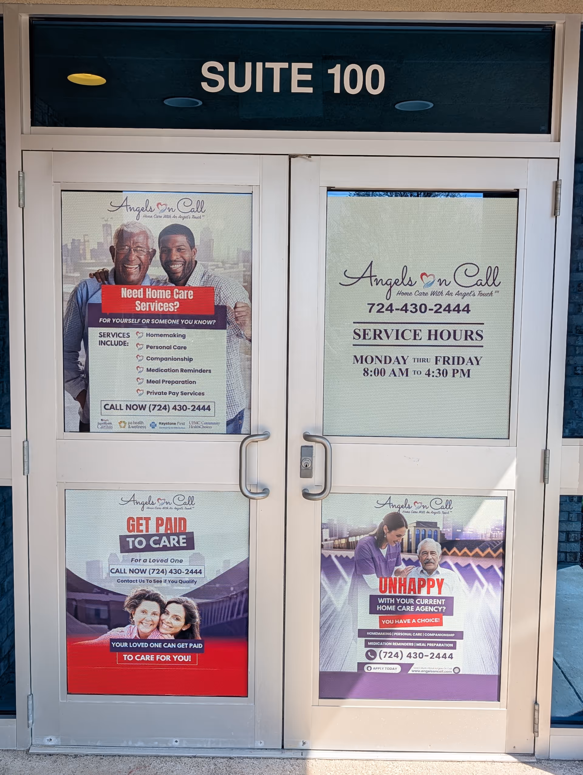 Exterior entrance labeled Suite 100 with promotional posters for Angels On Call Home Care.