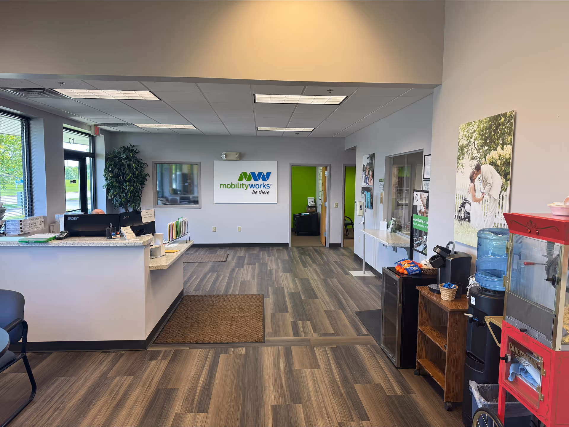 Interior MobilityWorks lobby with a reception desk, signage, and seating area.