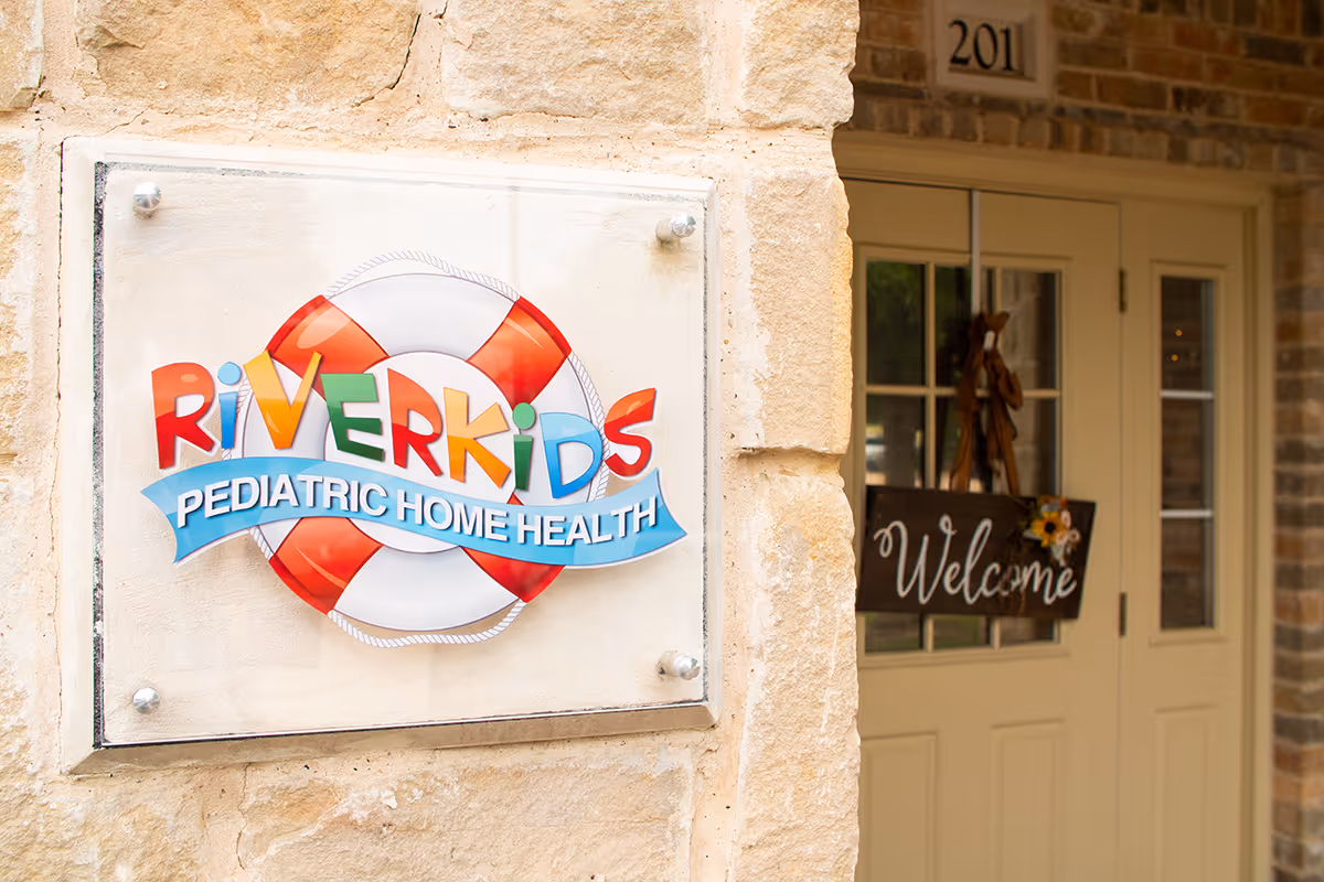 Front of RiverKids Pediatric Home Health facility with a welcoming door sign.