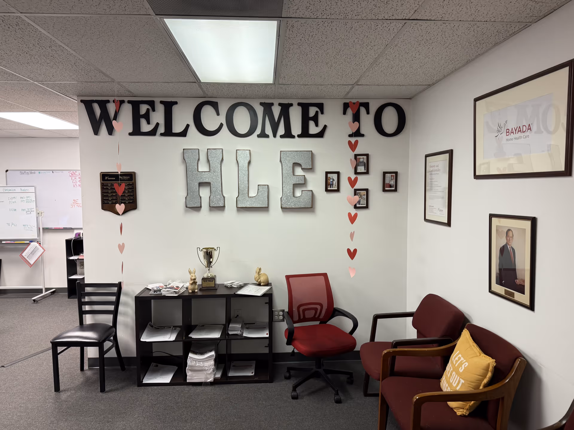 Reception area with chairs, desk, and welcome sign in a BAYADA facility.