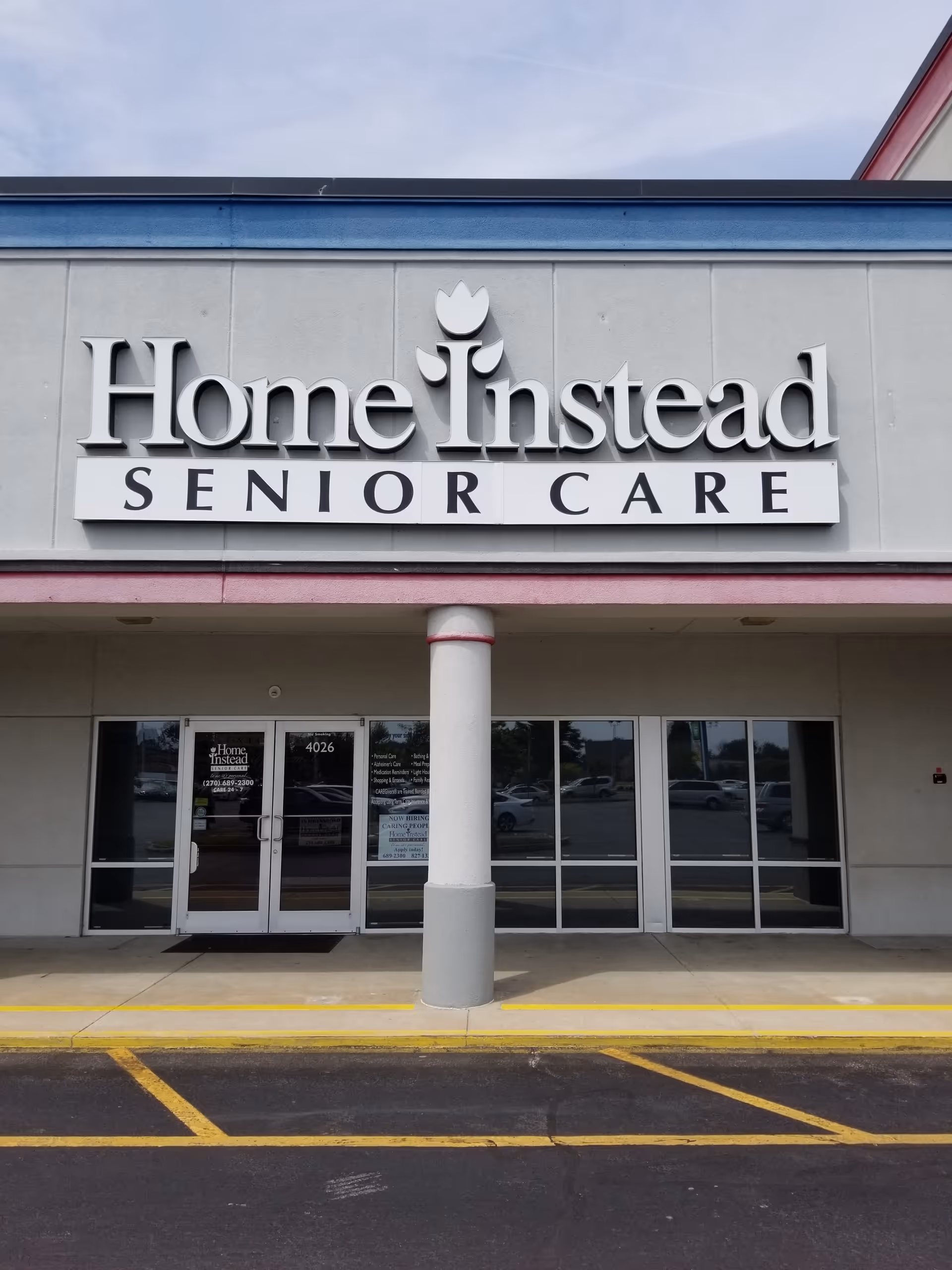 Front exterior of Home Instead Senior Care building with large sign