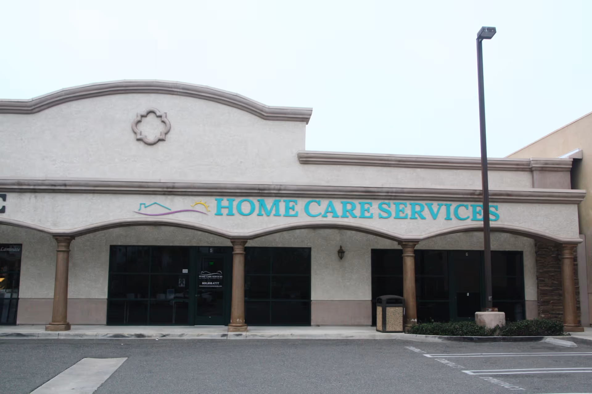 Facade of a senior home care building with arches and a HOME CARE SERVICES sign