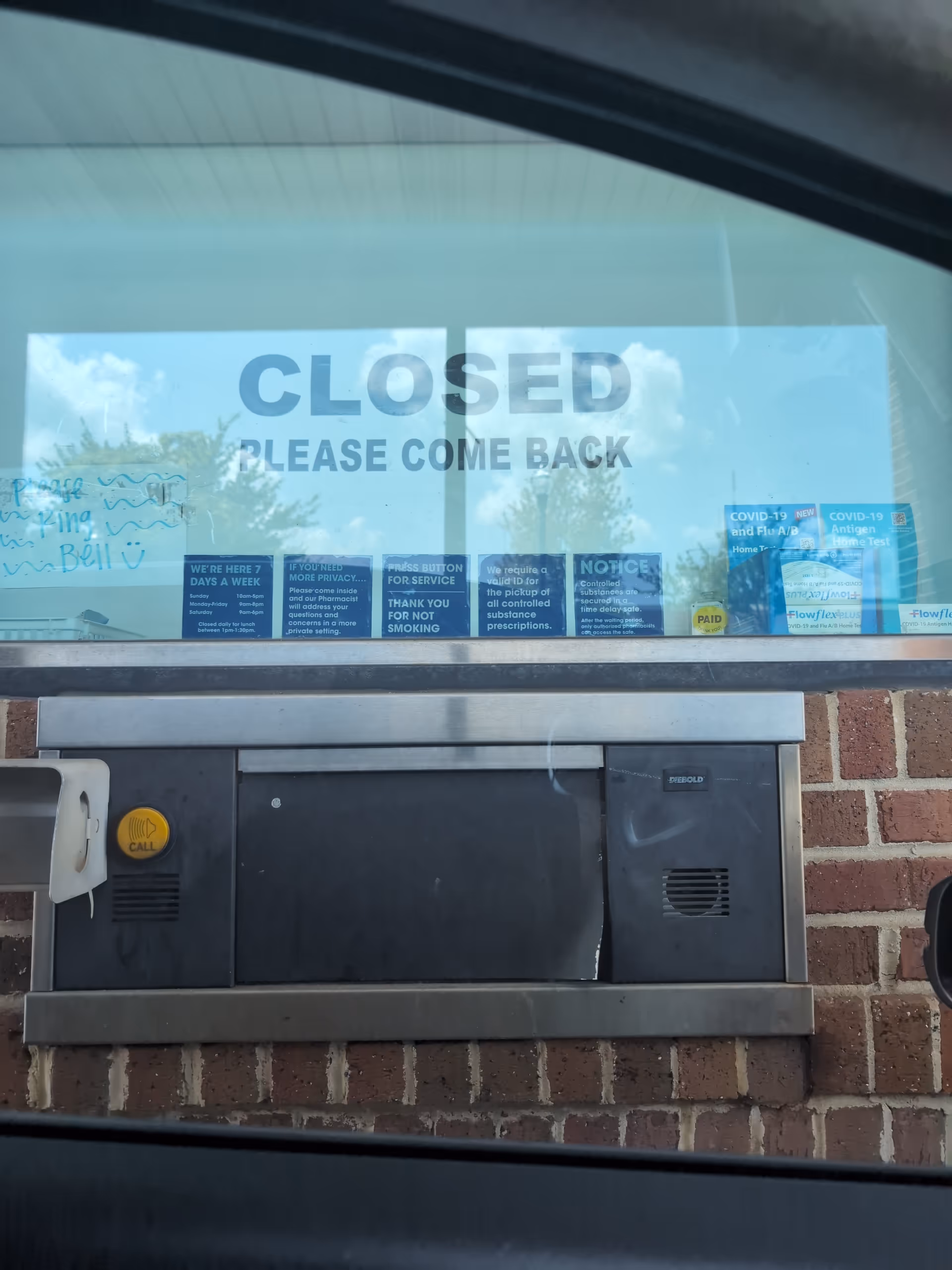 Closed Kroger Pharmacy drive-thru window with 'Please Come Back' sign.