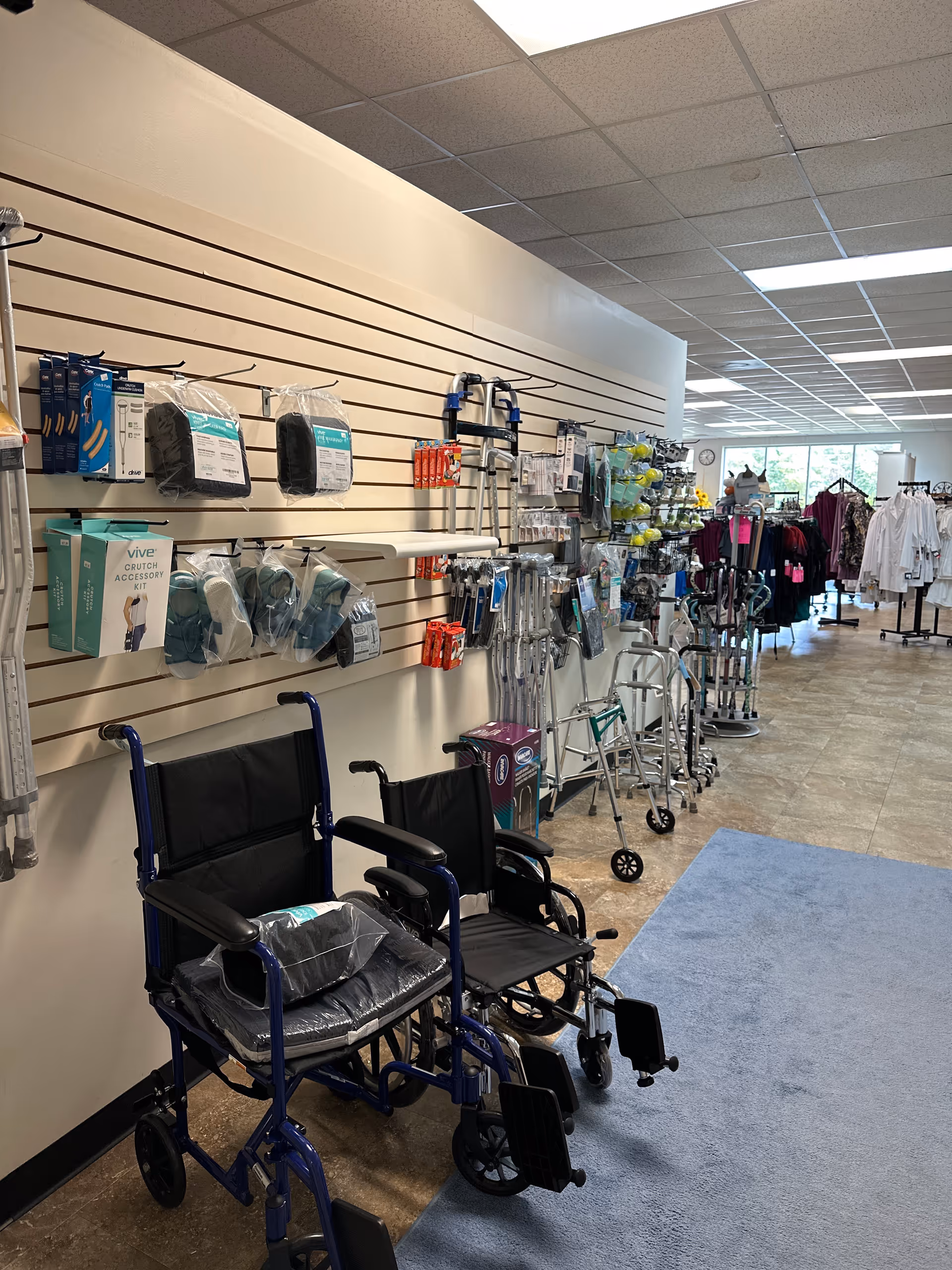 Interior store area displaying mobility aids such as wheelchairs, walkers, and canes.