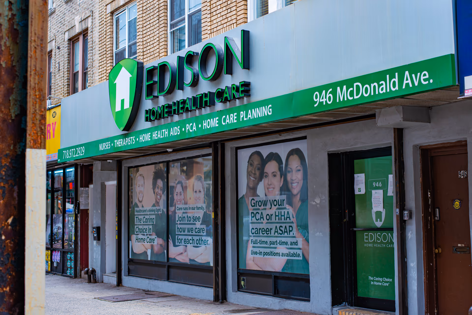 Storefront of Edison Home Health Care with green sign and posters in windows.