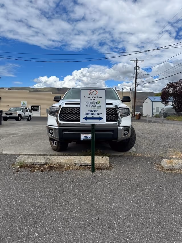 White pickup truck in a parking lot displaying Family Resource Home Care sign