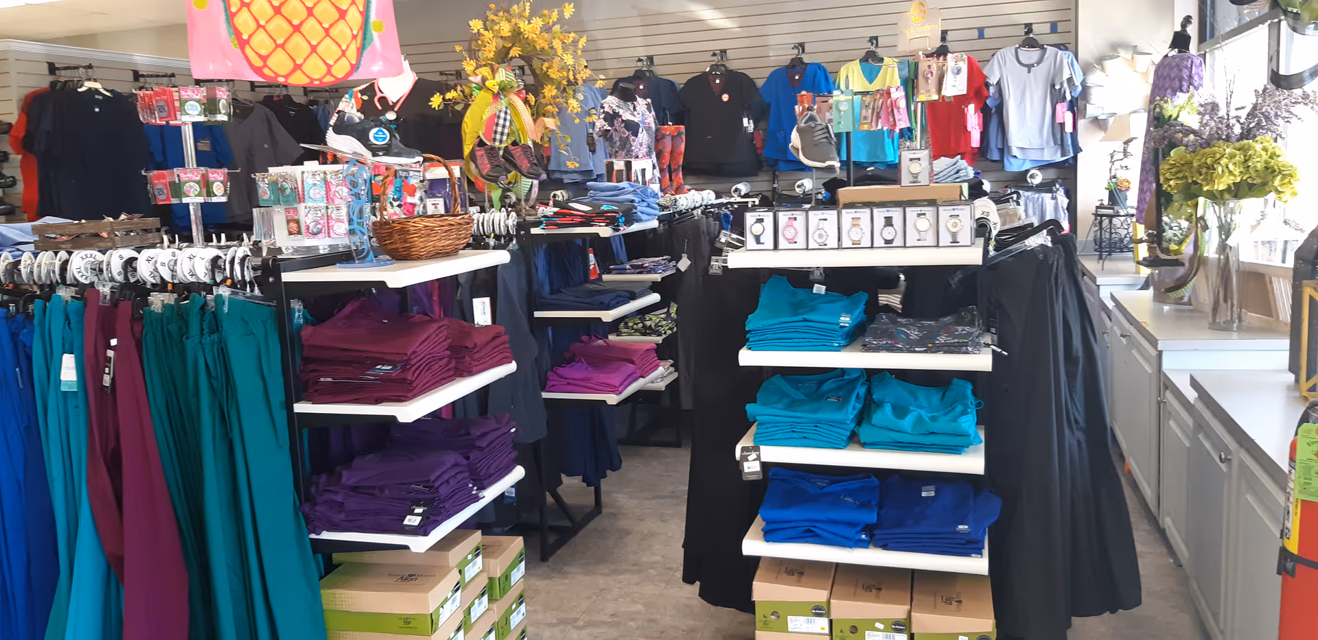 Indoor boutique inside the facility with colorful clothing on racks and shelves
