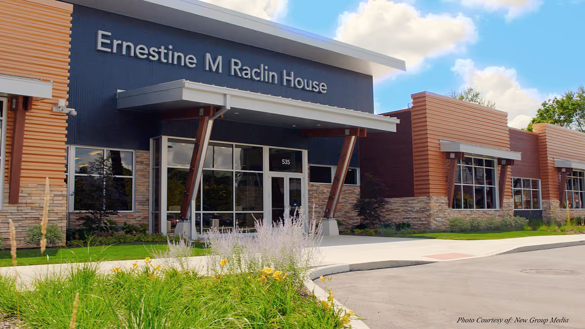 Front exterior of Center for Hospice Care building with glass doors.