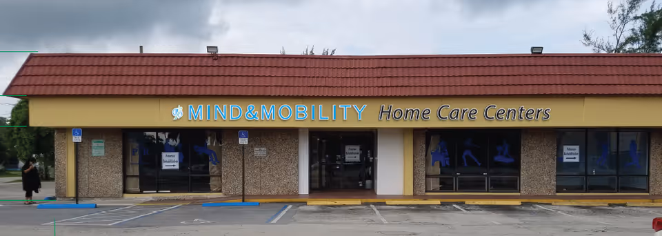 Front of Mind & Mobility Home Care Centers with glass doors and blue signage.