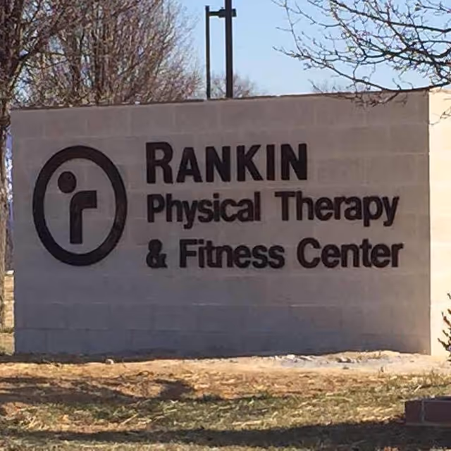 Outdoor sign displays Rankin Physical Therapy & Fitness Center logo and text.
