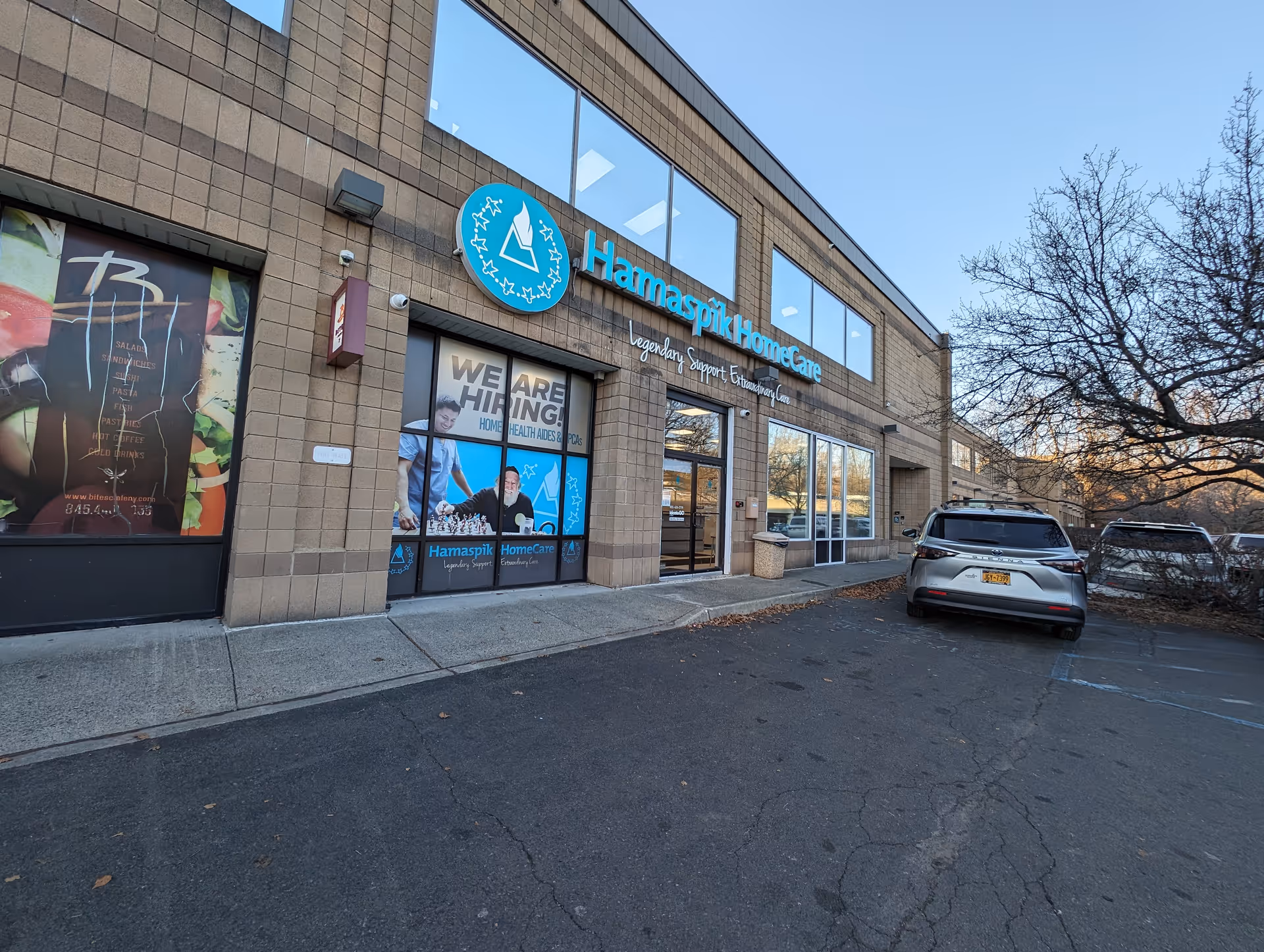 Hamaspik HomeCare building exterior with sign and parked cars in front