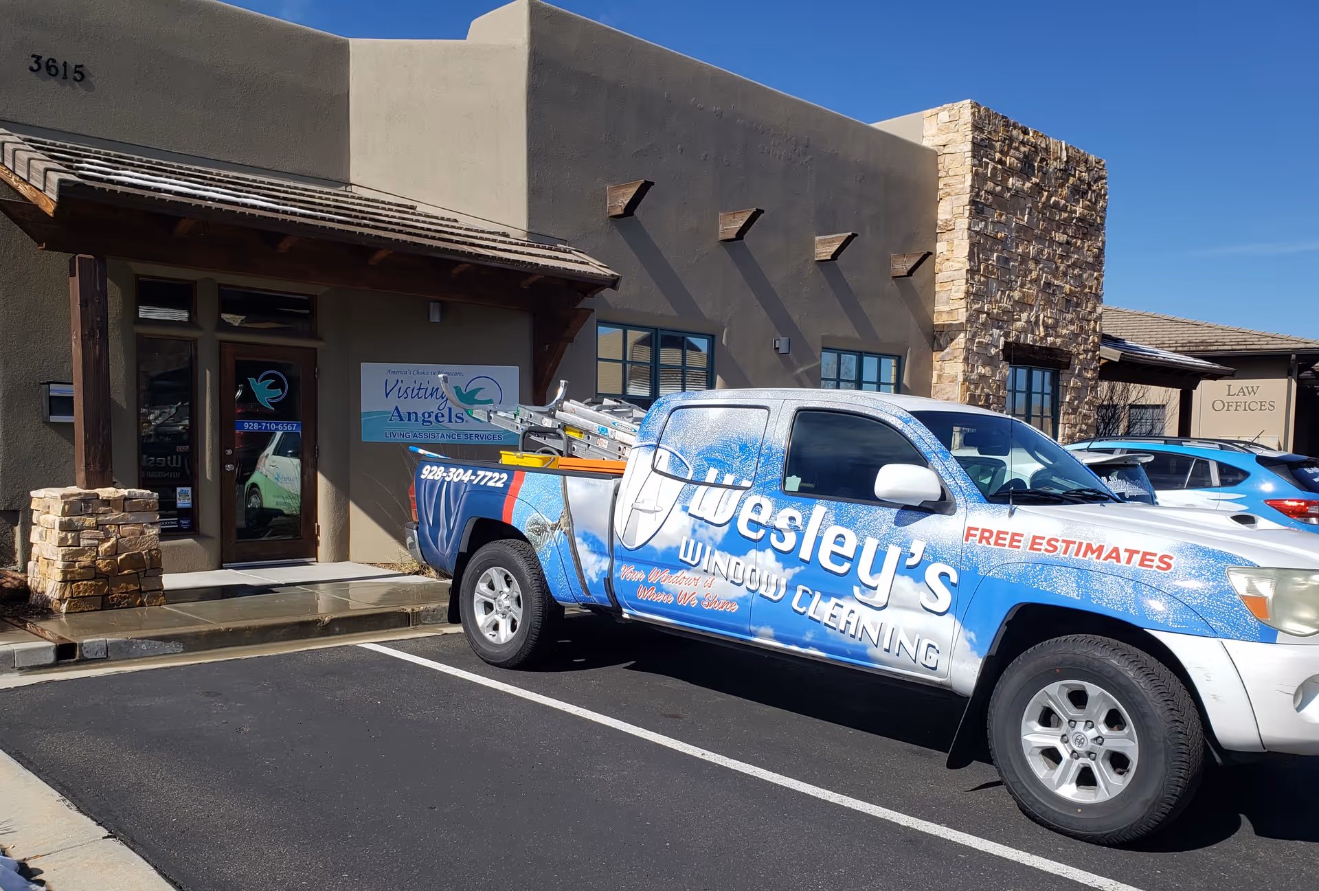 Exterior view of Visiting Angels Senior Home Care building with a branded service van parked.