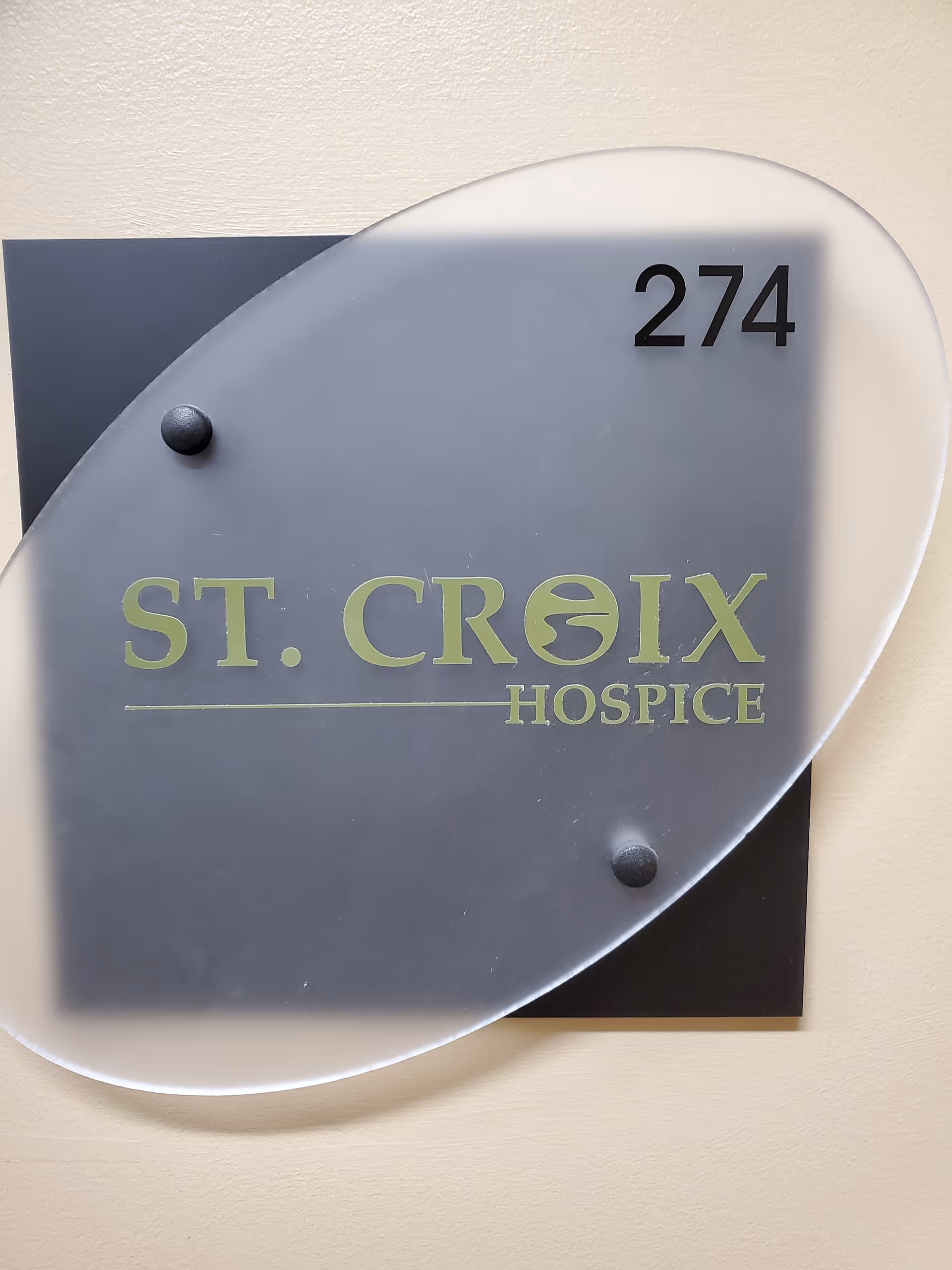 Indoor wall sign displaying St. Croix Hospice and unit number 274.