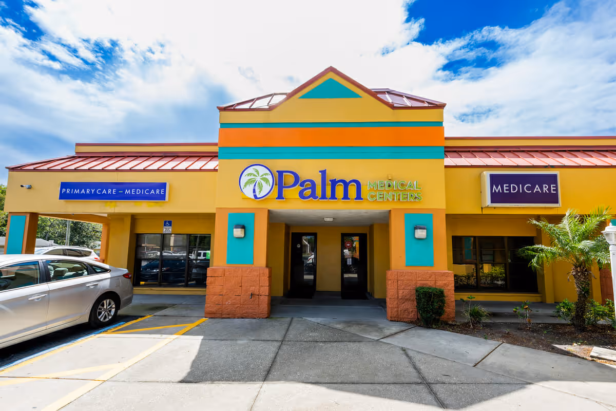 Bright yellow building exterior with turquoise accents and Palm Medical Centers signage.