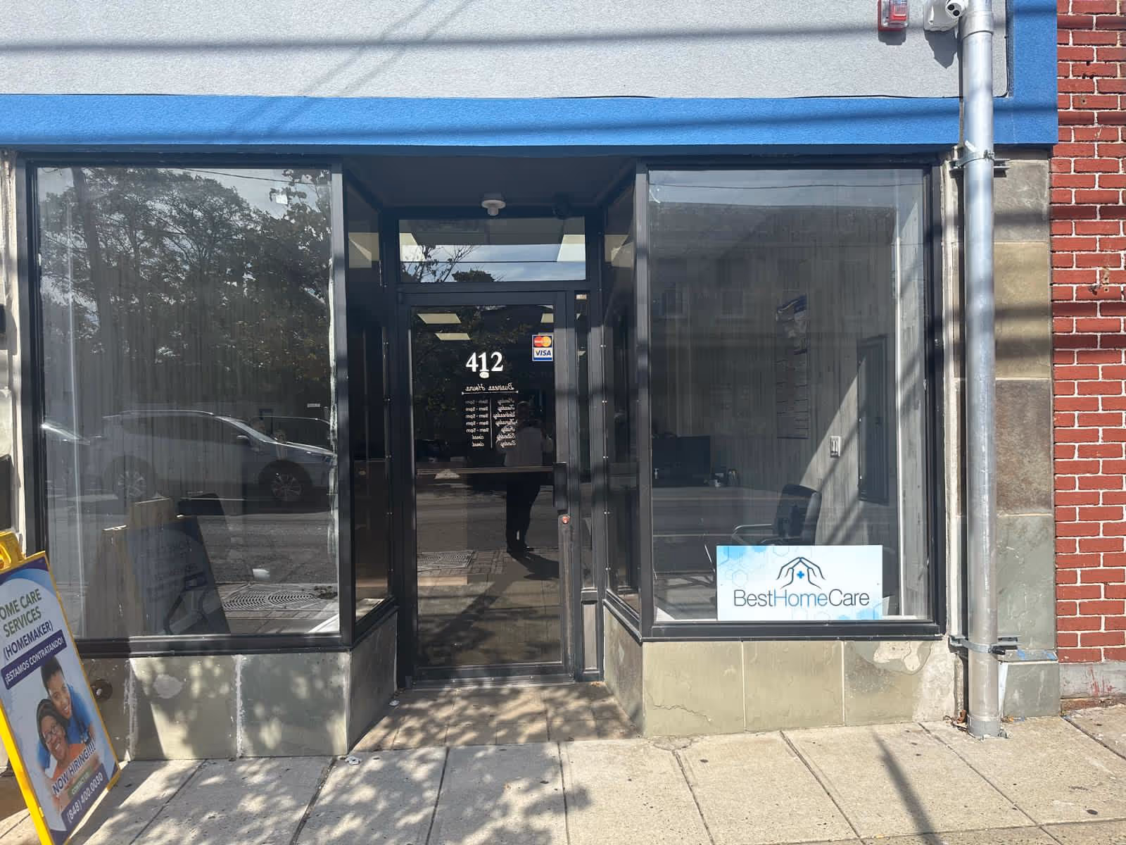 Storefront entrance of Best Home Care Inc with glass doors and sign.