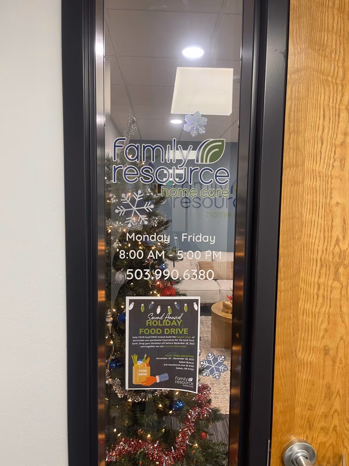 Glass door displays Family Resource Home Care logo with holiday decorations visible inside.