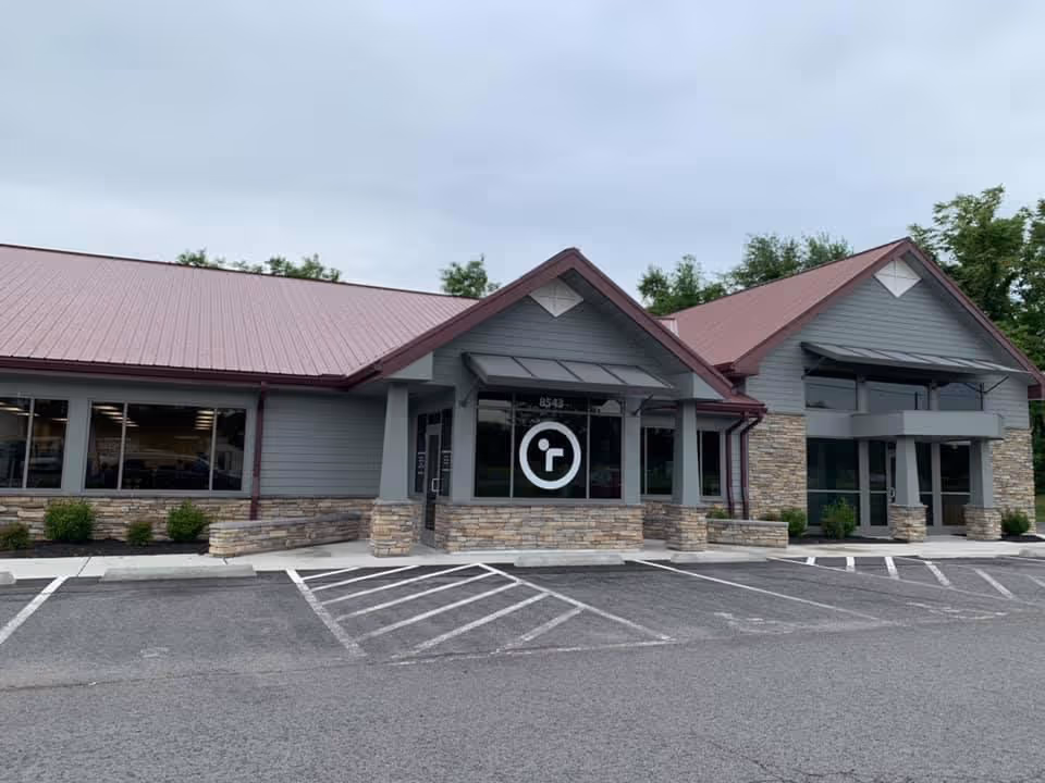 Exterior view of Rankin Rehabilitation facility with parking lot and front entrance.