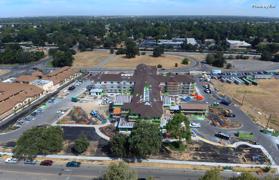 Aerial view of Apria Healthcare facility under construction, showing a brown roof and surrounding site work.