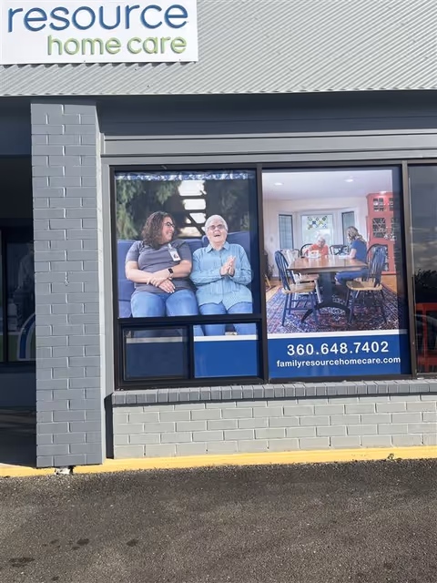 The storefront for Family Resource Home Care features a large window advertisement.