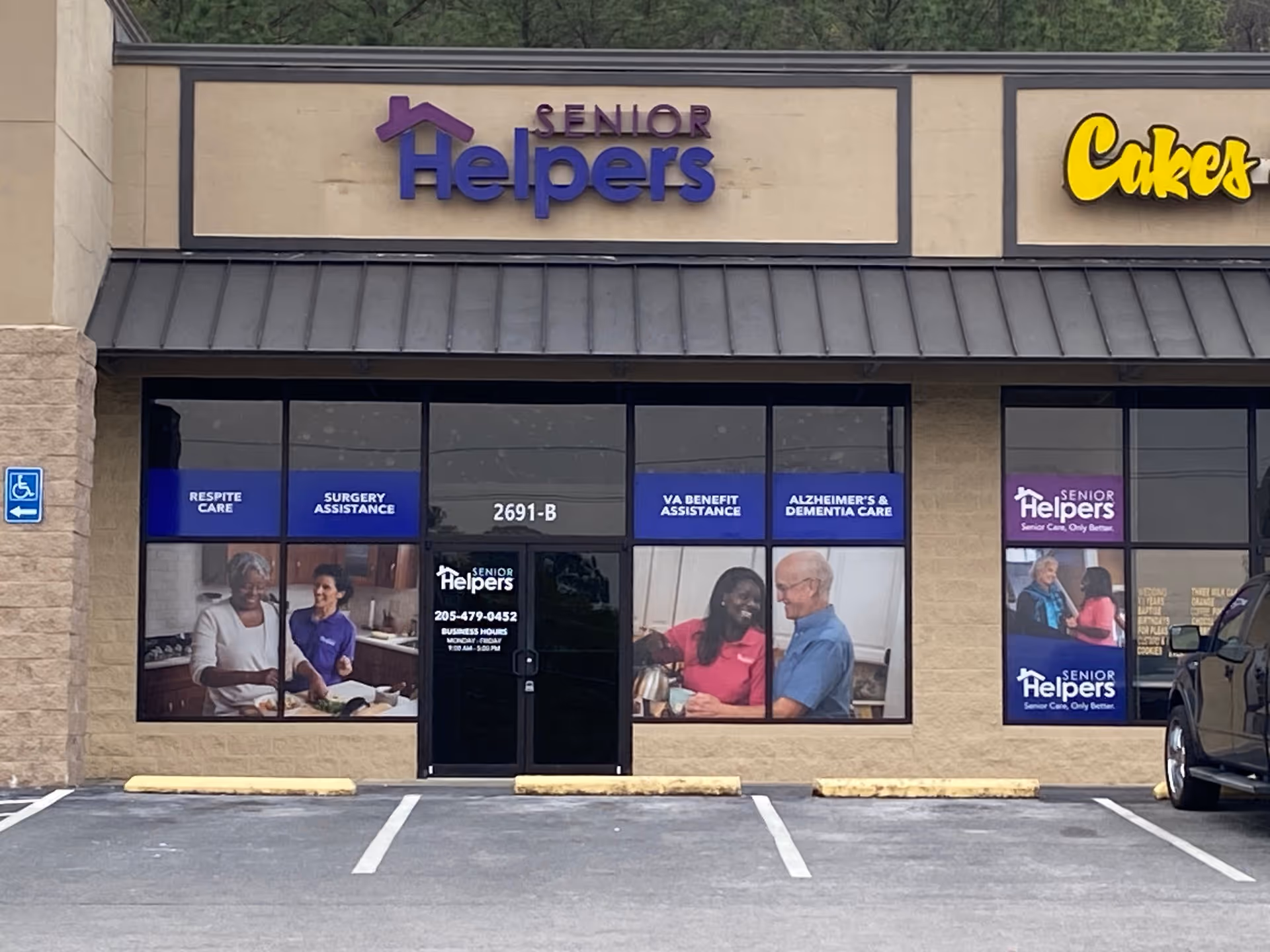 Exterior storefront of Senior Helpers with large windows and purple signage.