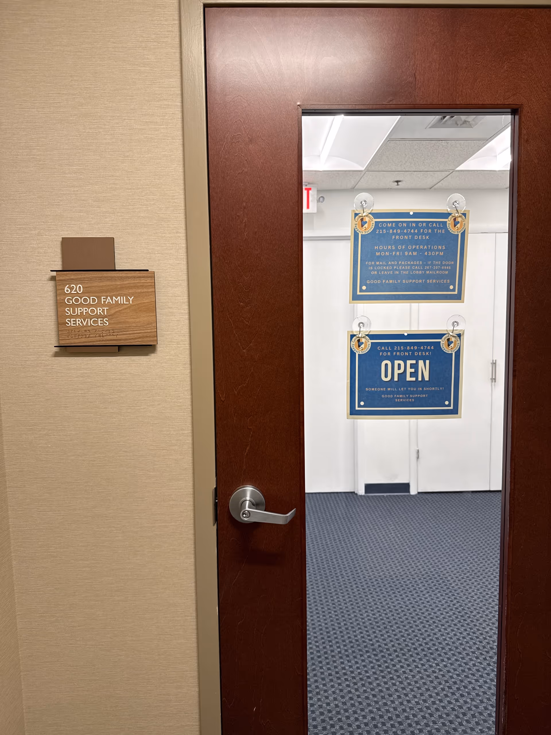 Wall plaque reads 620 Good Family Support Services beside a doorway into an interior hallway.