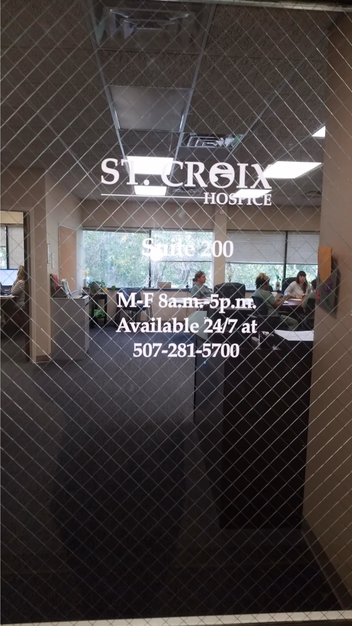 Interior lobby of St. Croix Hospice with staff at desks behind glass